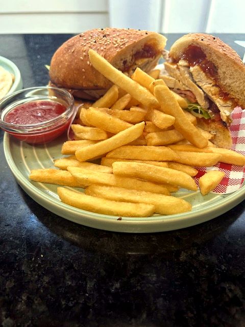 A pub burger piled high with a generous serve of chips