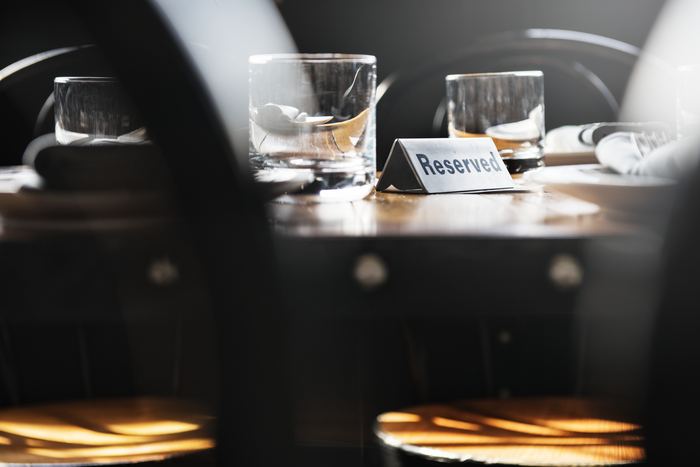 A reserved table set with glasses